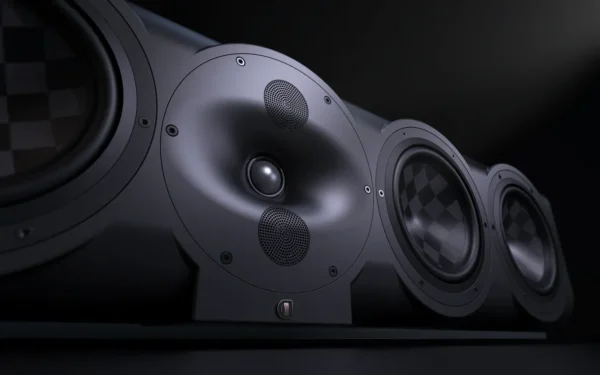 A close up of speakers on top of a table