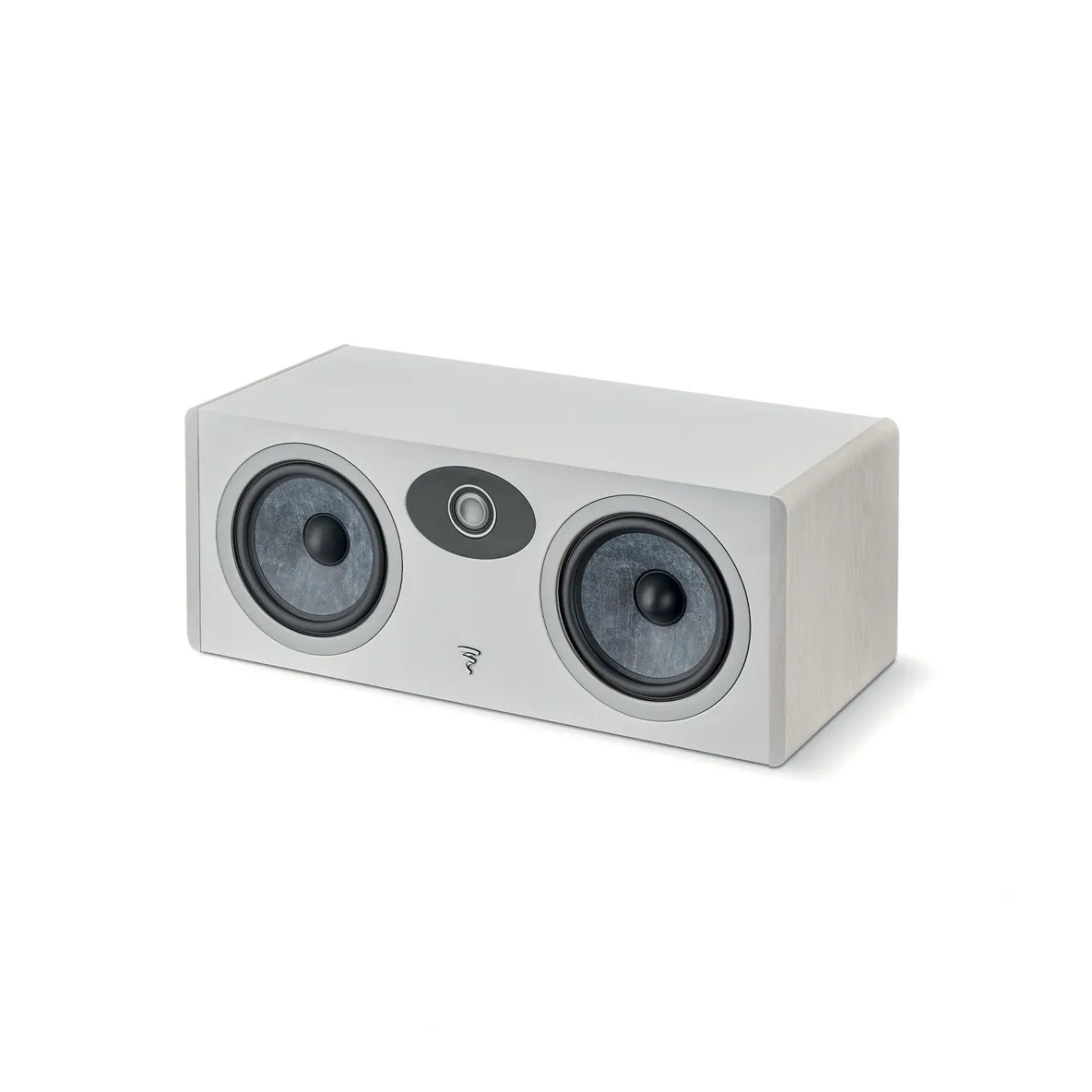 A white speaker sitting on top of a floor.