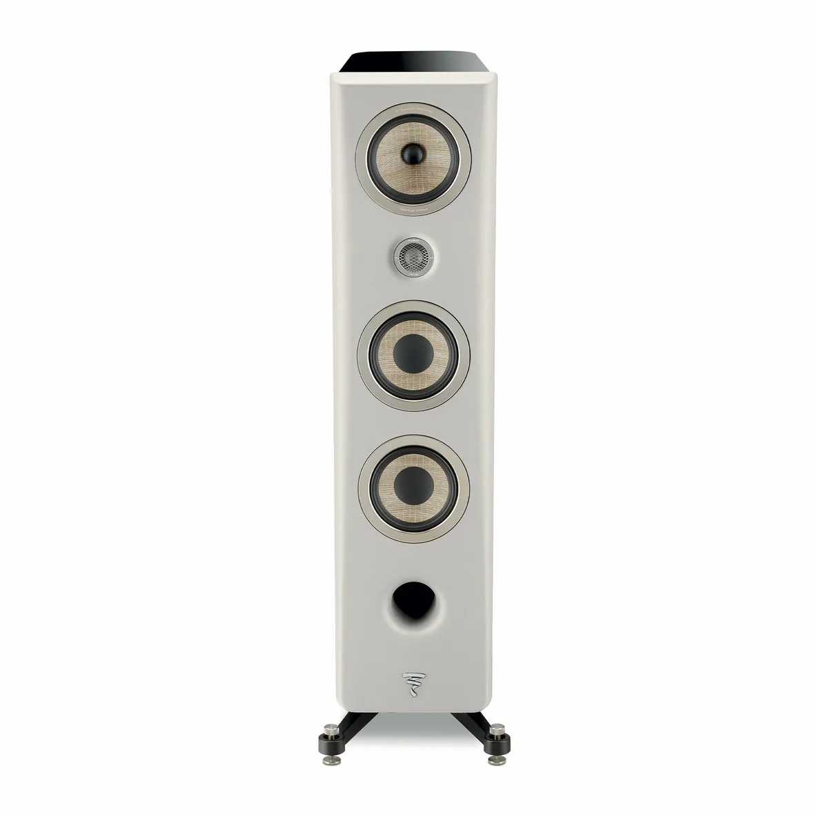 A white speaker is standing up on the floor.