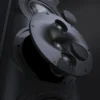 A close up of the speakers on a wall