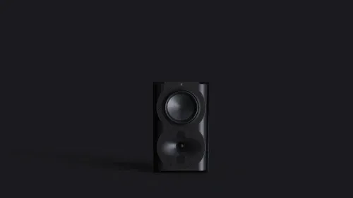 A black speaker is in front of a dark background.