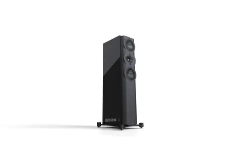 A black speaker is standing up on its stand.